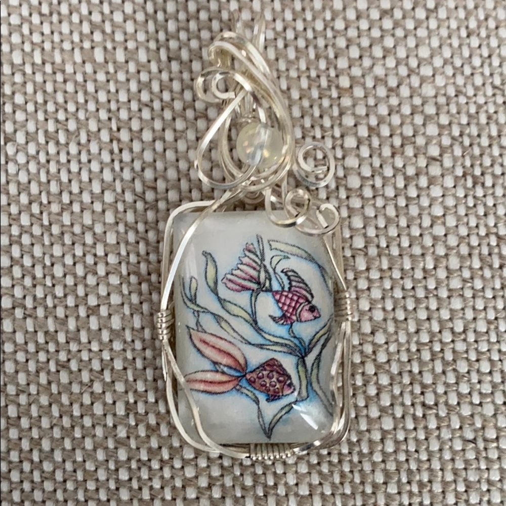Glass and silver pendant with image of 2 Fish